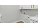 Bright laundry room features white cabinetry and convenient utility connections for modern appliances at 26619 S 169Th Pl, Queen Creek, AZ 85142