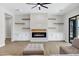 Bright living room showcases a modern fireplace, built-ins, and neutral color palette at 26619 S 169Th Pl, Queen Creek, AZ 85142