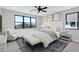 Comfortable main bedroom with large windows and soft, neutral tones at 26619 S 169Th Pl, Queen Creek, AZ 85142