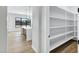 Walk-in pantry features open shelving, providing ample storage for kitchen essentials at 26619 S 169Th Pl, Queen Creek, AZ 85142