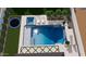 Aerial view of the sparkling pool and spa combo in a well-landscaped backyard at 26619 S 169Th Pl, Queen Creek, AZ 85142