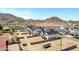 A neighborhood view of desert homes, showcasing exteriors with mountains and wide open spaces at 26619 S 169Th Pl, Queen Creek, AZ 85142
