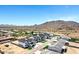A street view of modern white houses with black roofs in a developing desert neighborhood at 26619 S 169Th Pl, Queen Creek, AZ 85142