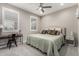 Neutral toned bedroom featuring carpet, plantation shutters and stylish decor at 27021 W Kerry Ln, Buckeye, AZ 85396