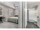 Comfortable bedroom leading to a bathroom at 27021 W Kerry Ln, Buckeye, AZ 85396