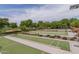Well-maintained bocce ball courts with shade ramadas and seating areas at 27021 W Kerry Ln, Buckeye, AZ 85396
