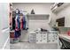 Walk-in closet with carpet, shelving and drawers at 27021 W Kerry Ln, Buckeye, AZ 85396