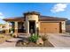 Attractive single-story home boasting a desert-themed front yard and neutral color palette at 27021 W Kerry Ln, Buckeye, AZ 85396