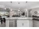 Kitchen island with granite countertop overlooks the dining and living areas at 27021 W Kerry Ln, Buckeye, AZ 85396