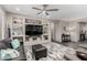 Comfortable living room features built-in shelving, stylish decor, and comfortable seating at 27021 W Kerry Ln, Buckeye, AZ 85396