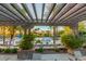 Resort-style pool area with ample seating and shaded pergola, perfect for relaxation at 27021 W Kerry Ln, Buckeye, AZ 85396