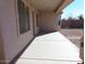 Covered back patio with concrete flooring and views of the backyard at 29797 W Mitchell Ave, Buckeye, AZ 85396