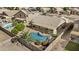 Aerial view of the house featuring a private pool, covered patio, and landscaped backyard at 300 W Windsor Dr, Gilbert, AZ 85233