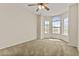 Bright bedroom with large windows and neutral carpet at 300 W Windsor Dr, Gilbert, AZ 85233