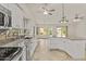 Spacious kitchen with island, granite counters, stainless appliances, and backyard views at 300 W Windsor Dr, Gilbert, AZ 85233