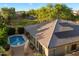 View of home with pool and solar panels on roof at 3350 S Holguin Way, Chandler, AZ 85248
