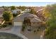 Aerial view of home with a circular driveway, fountain and mature landscaping at 3350 S Holguin Way, Chandler, AZ 85248