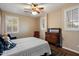 Bedroom showcasing a ceiling fan, shutters, hardwood floors, and antique furniture at 3350 S Holguin Way, Chandler, AZ 85248