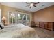 Inviting bedroom with hardwood floors and private patio access at 3350 S Holguin Way, Chandler, AZ 85248