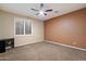 Bedroom with ceiling fan, shuttered windows, a neutral color palette, and carpet at 3350 S Holguin Way, Chandler, AZ 85248