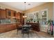 Elegant dining area with built-in cabinets, shutters, and views to the backyard at 3350 S Holguin Way, Chandler, AZ 85248