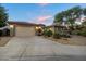 Charming single-Gathering home with a well-manicured front yard and a spacious driveway leading to a two-car garage at 3350 S Holguin Way, Chandler, AZ 85248