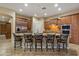 Spacious kitchen featuring a large island, granite countertops, and stainless steel appliances at 3350 S Holguin Way, Chandler, AZ 85248
