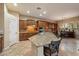 Open kitchen with custom cabinets, granite countertops, and a dining area, perfect for entertaining at 3350 S Holguin Way, Chandler, AZ 85248