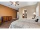 Spacious bedroom featuring an ensuite bath, hardwood floors and a decorative dresser at 3350 S Holguin Way, Chandler, AZ 85248