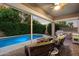 Inviting outdoor patio with wicker furniture overlooking the sparkling pool at 3350 S Holguin Way, Chandler, AZ 85248