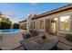 Outdoor patio with dining, comfortable seating, and a sparkling pool, perfect for relaxation and entertainment at 3350 S Holguin Way, Chandler, AZ 85248