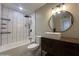 Brightly lit bathroom featuring modern hardware, vanity, and walk-in shower at 3538 W Sierra Vista Dr, Phoenix, AZ 85019
