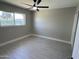 A bright bedroom with a ceiling fan and closet is move-in ready at 3538 W Sierra Vista Dr, Phoenix, AZ 85019