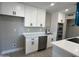 Bright kitchen featuring stainless steel appliances and white cabinetry at 3538 W Sierra Vista Dr, Phoenix, AZ 85019