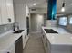Bright kitchen featuring stainless steel appliances, quartz countertops, and range hood at 3538 W Sierra Vista Dr, Phoenix, AZ 85019