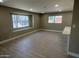 Brightly lit living room featuring hardwood flooring, ample windows, and connected breakfast bar seating at 3538 W Sierra Vista Dr, Phoenix, AZ 85019