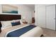 Bedroom featuring a queen sized bed, a closet with sliding doors, and an abstract painting at 35397 N Shorthorn Trl, San Tan Valley, AZ 85143