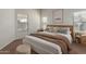 Well-lit bedroom with carpet, minimalist decor and two windows at 35397 N Shorthorn Trl, San Tan Valley, AZ 85143