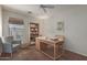 Bedroom featuring a chair, bookshelf and desk; staged for new homeowner at 35397 N Shorthorn Trl, San Tan Valley, AZ 85143