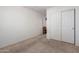 Neutral bedroom featuring a closet with sliding doors and neutral carpeting at 35397 N Shorthorn Trl, San Tan Valley, AZ 85143