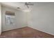 Bedroom with neutral carpet, ceiling fan, and natural light at 35397 N Shorthorn Trl, San Tan Valley, AZ 85143