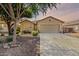 Charming single-story home featuring a two-car garage and low-maintenance desert landscaping at 35397 N Shorthorn Trl, San Tan Valley, AZ 85143