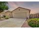 Single-story home with neutral stucco and low-maintenance yard, plus a two-car garage at 35397 N Shorthorn Trl, San Tan Valley, AZ 85143