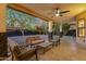 Inviting covered patio with comfortable seating and a ceiling fan, great for outdoor living at 3842 W Ironwood Dr, Chandler, AZ 85226