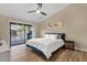 Bright bedroom featuring patio access and wood-style flooring at 3842 W Ironwood Dr, Chandler, AZ 85226