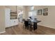 Charming dining area featuring a modern table, wood floors, and natural light streaming through plantation shutters at 3842 W Ironwood Dr, Chandler, AZ 85226