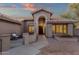 Inviting front entrance featuring a decorative door, desert landscaping, and a cozy seating area at 3842 W Ironwood Dr, Chandler, AZ 85226