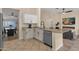Open kitchen featuring granite countertops, stainless steel dishwasher, and white cabinets at 3842 W Ironwood Dr, Chandler, AZ 85226