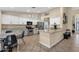 Bright kitchen with a granite island, tile floors, and a stainless steel appliances at 3842 W Ironwood Dr, Chandler, AZ 85226