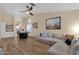 Comfortable living room and dining area with wood floors and a view into the bright kitchen at 3842 W Ironwood Dr, Chandler, AZ 85226